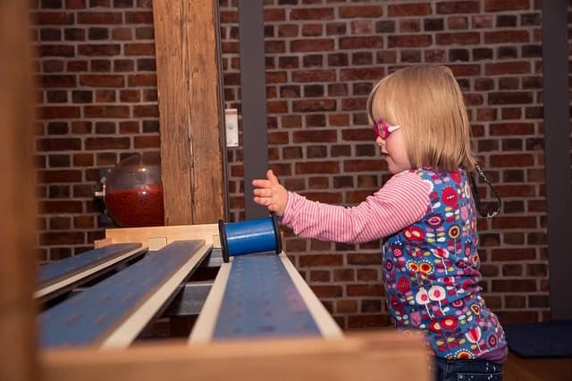 Downs syndrome girl playing